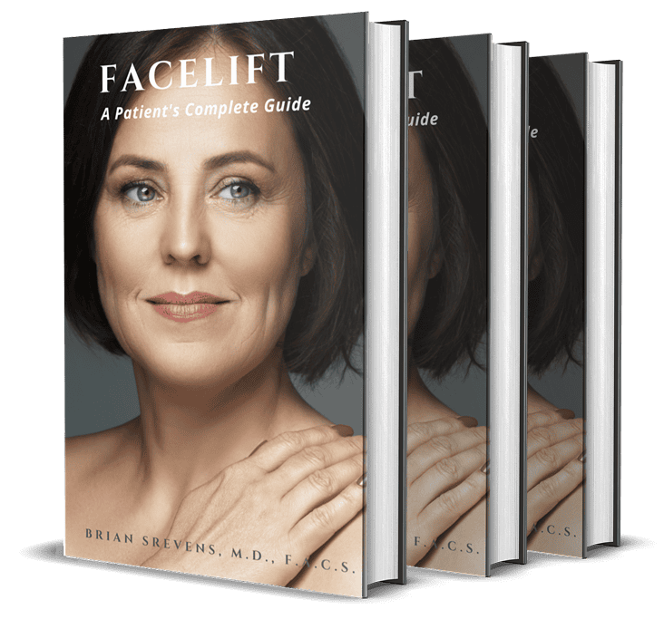 Stacked copies of the Facelift book showcasing a professionally produced cover and finished publication.